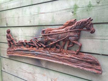 Wanddecoratie , gietijzeren haardplaat boer met paard en ploeg